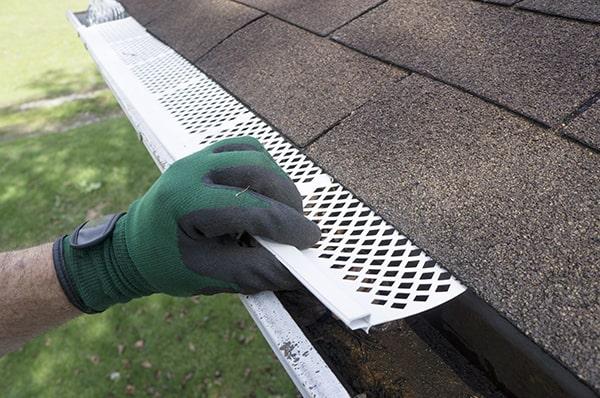 gutter guards are designed to handle heavy rain and snow, allowing water to flow through while keeping debris out